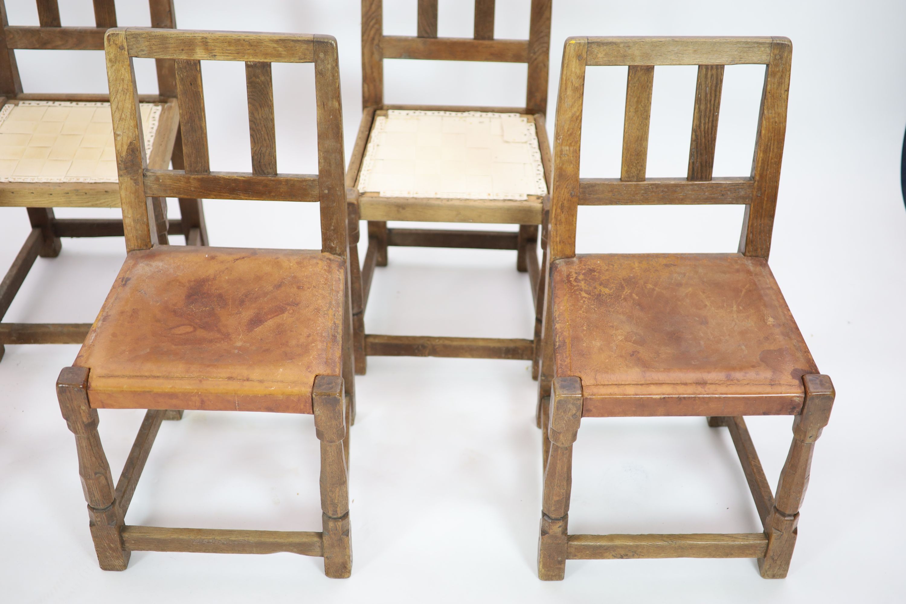 A set of six Robert Thompson 'Mouseman' oak dining chairs